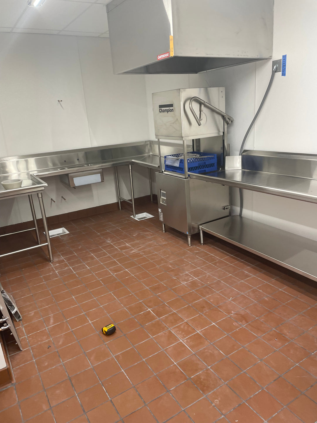 commercial dishwashing equipment, hood and sinks set up for customer's preferred work flow.