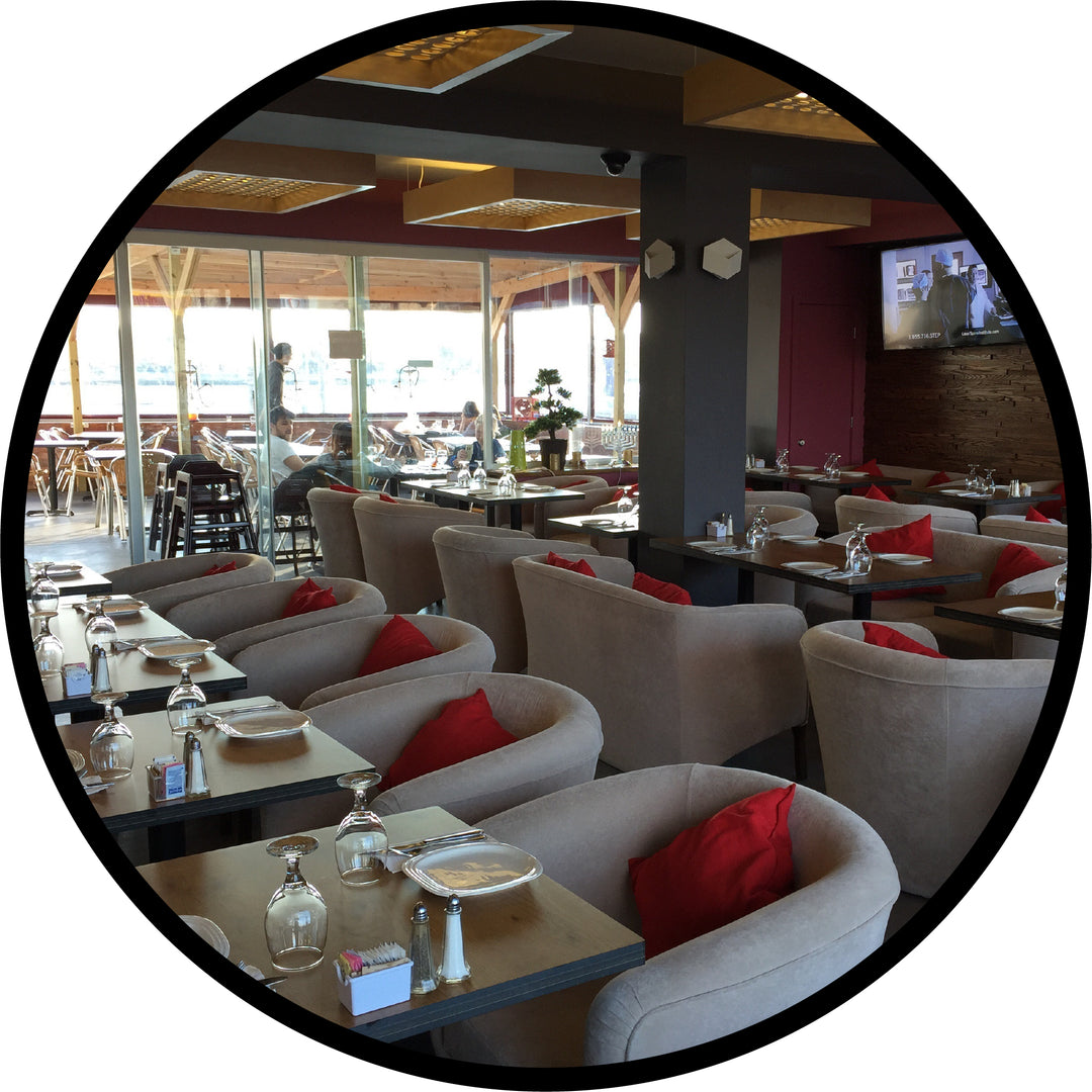 Modern mid-century restaurant chairs setup with commercial tables in the dining area of a restaurant