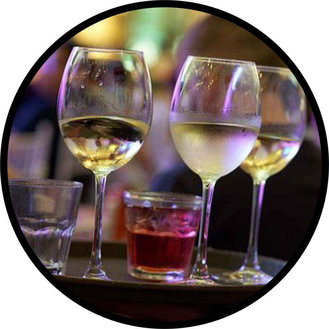 Bar scene with wine and rocks glasses on a server tray