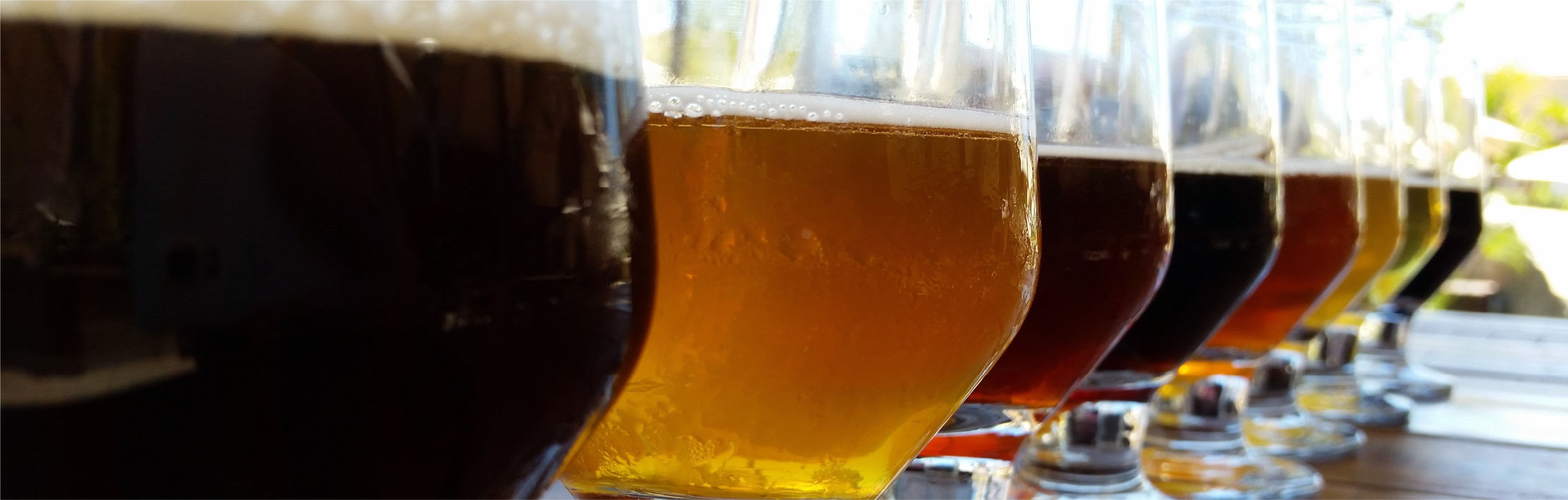 Beer flight lined up on a bar top