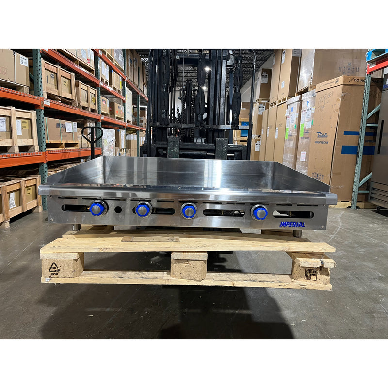 Front head-on view of a USED 48” W x 30" D Thermostatic Commercial Griddle with 1" Thick Chrome Mirror Finish Flat Top Nat. Gas (Imperial ITG4830CG)